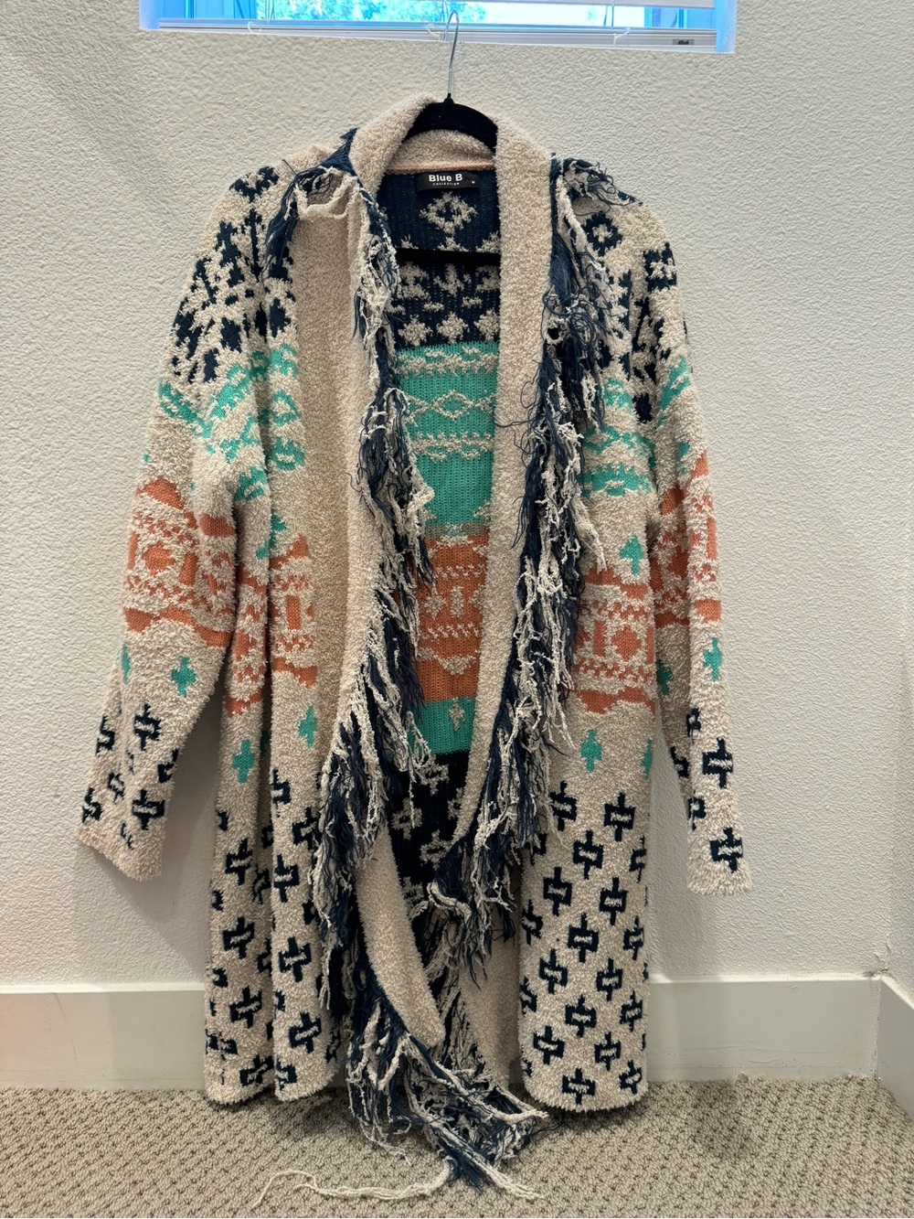 Blue B Collection w/ colorful Aztec designs & fringe detailing sweater